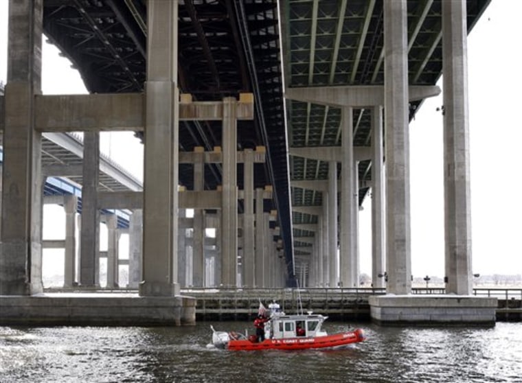A U.S. Coast Guard boat searches the Raritan River under the Driscoll Bridge Wednesday, Feb. 17, 2010, near Sayreville, N.J., for a 3-month-old girl after her father said he threw the infant  off the bridge and into the river. 